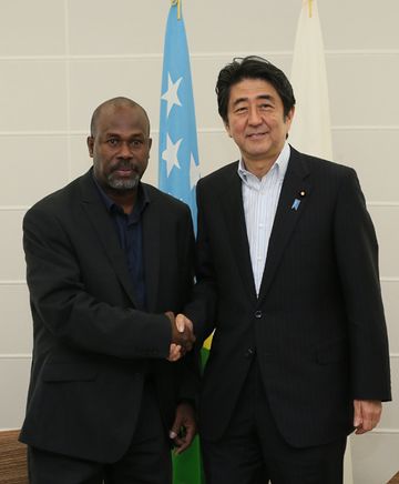 Photograph of the Prime Minister shaking hands with the Deputy Prime Minister of the Solomon Islands