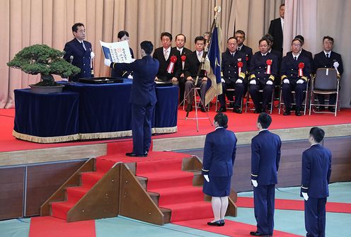 Photograph of the Prime Minister overseeing the graduation ceremony