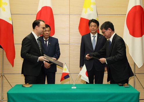 Photograph of the leaders attending the signing ceremony