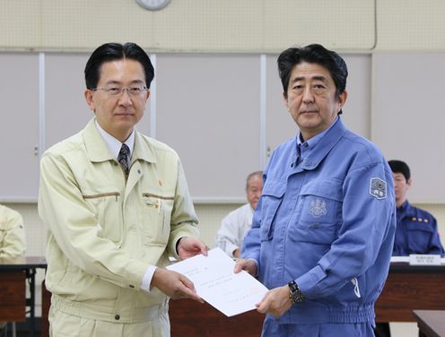 Photograph of the Prime Minister receiving a letter of request