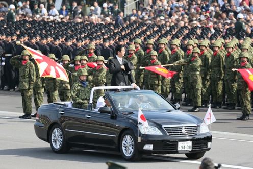 Photograph of the Prime Minister reviewing units