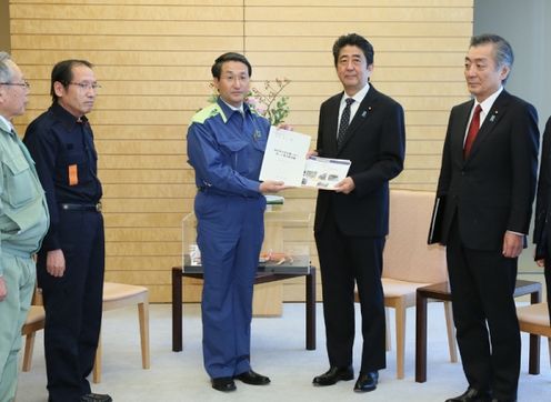 Photograph of the Prime Minister receiving the letter of request