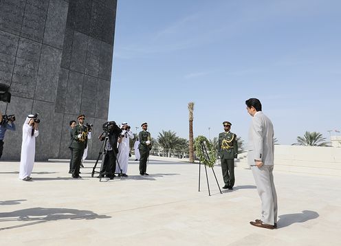 Photograph of the Prime Minister offering flowers at the memorial commemorating those who have lost their lives in service to the UAE