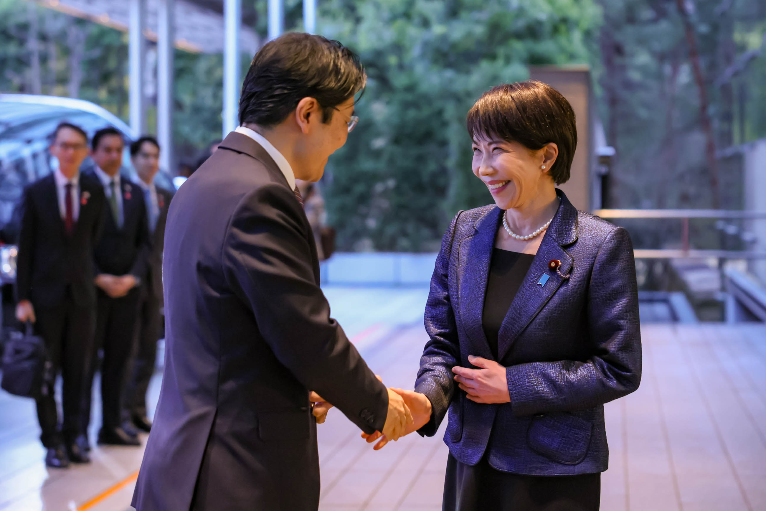 Prime Minister Takaichi welcoming Prime Minister Wong