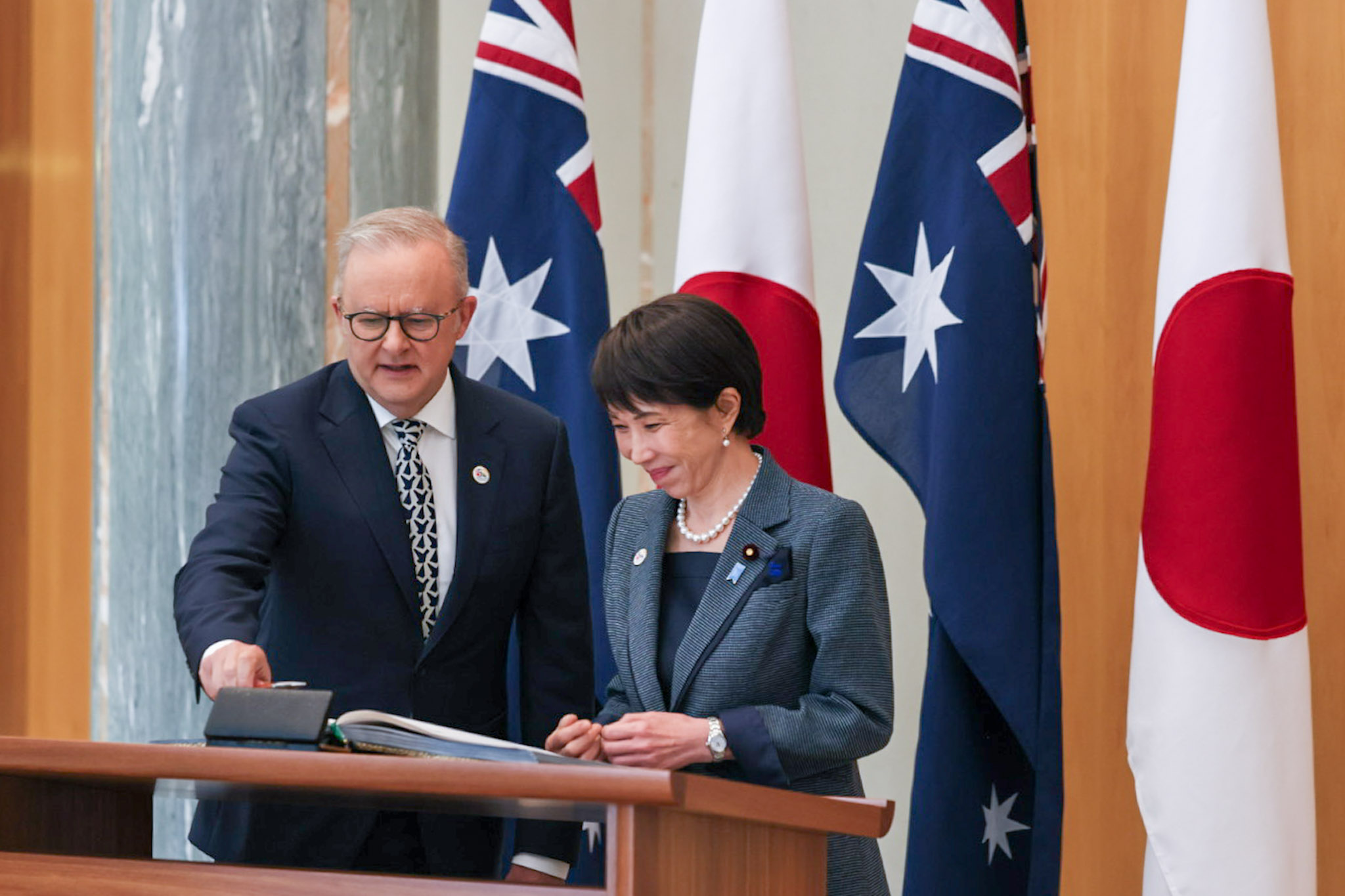 Prime Minister Takaichi signing the Guest Book (1)