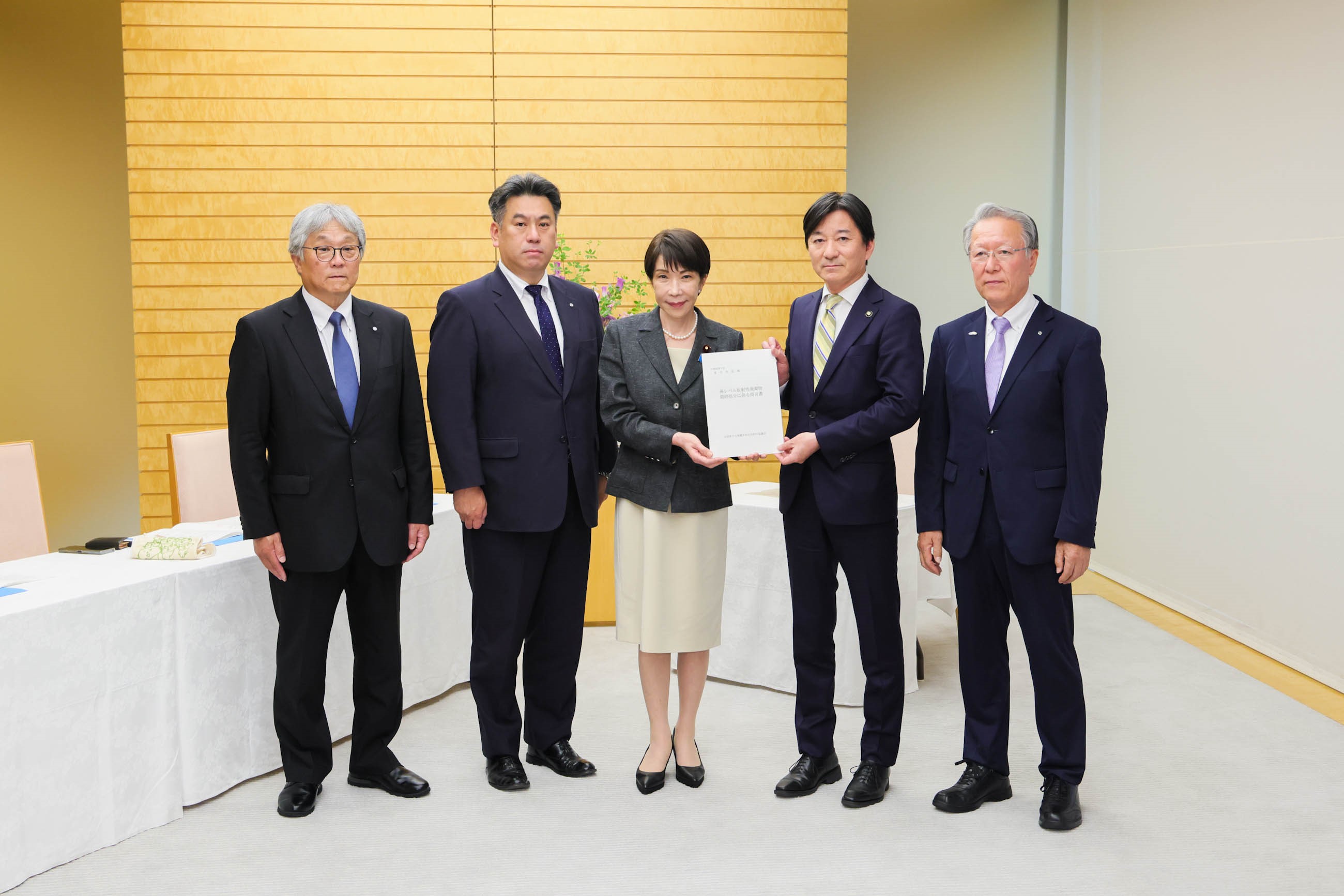 Prime Minister Takaichi receiving a proposal
