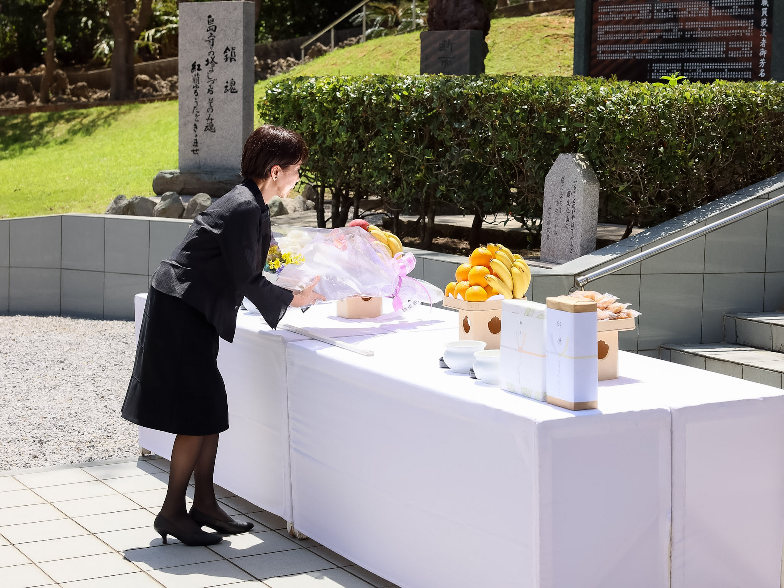 Prime Minister TAKAICHI offering flowers at the Tower of Shimamori 1