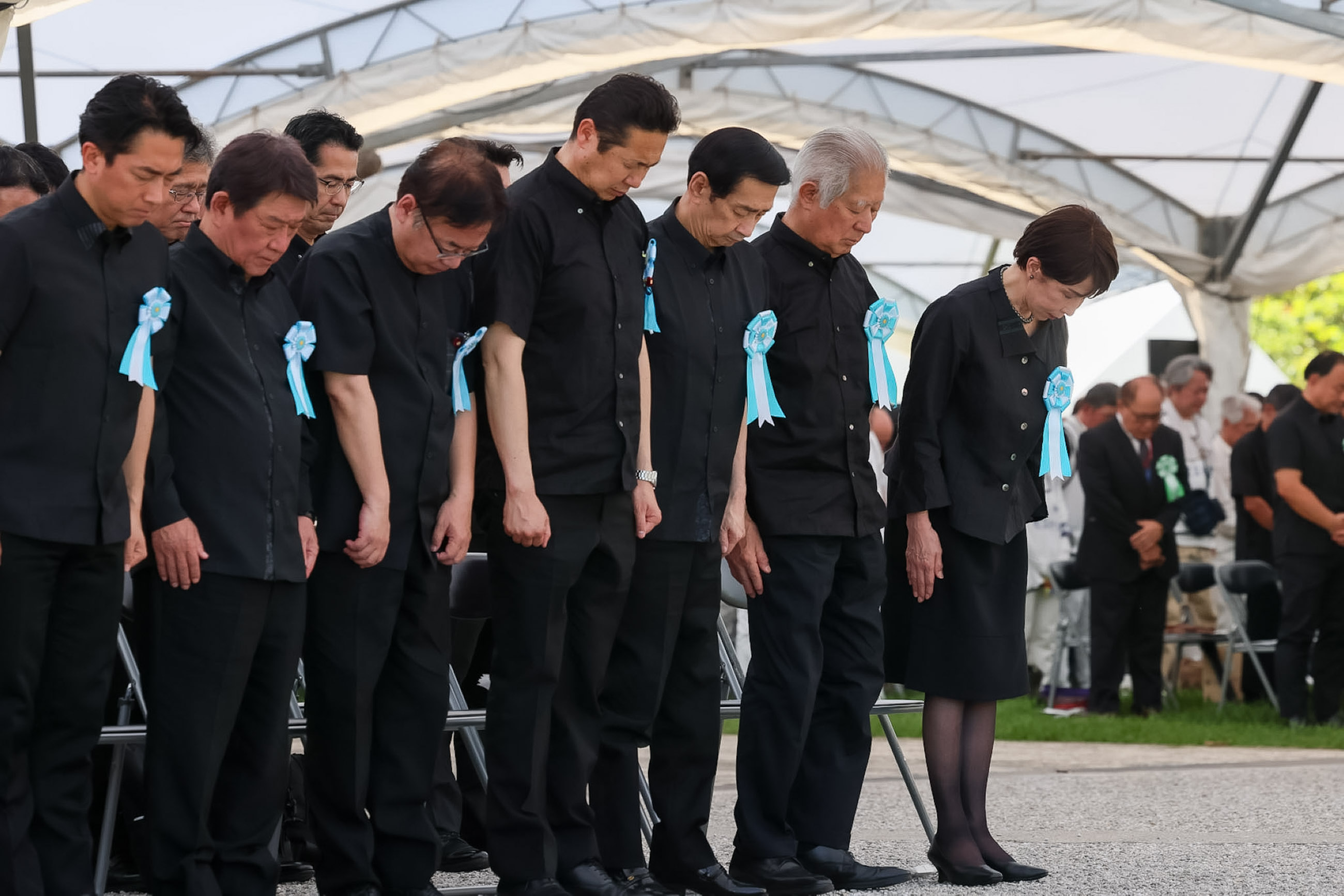 Prime Minister TAKAICHI observing a moment of silence at the memorial ceremony
