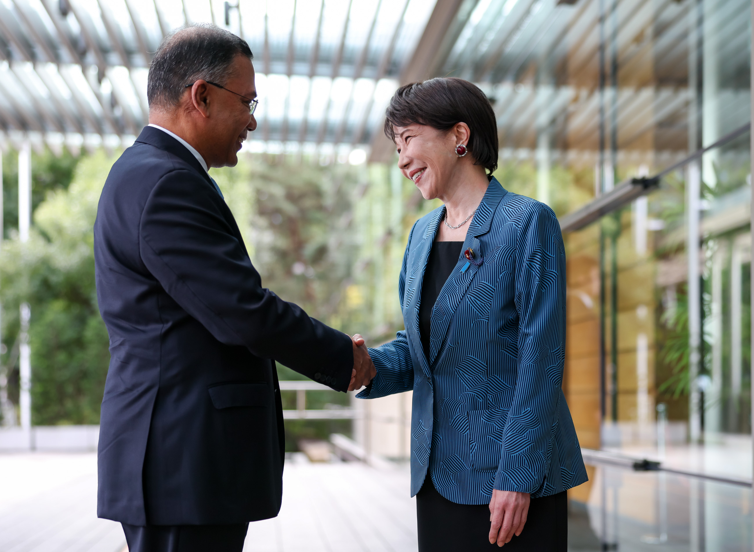 Prime Minister Takaichi welcoming Prime Minister Rahman