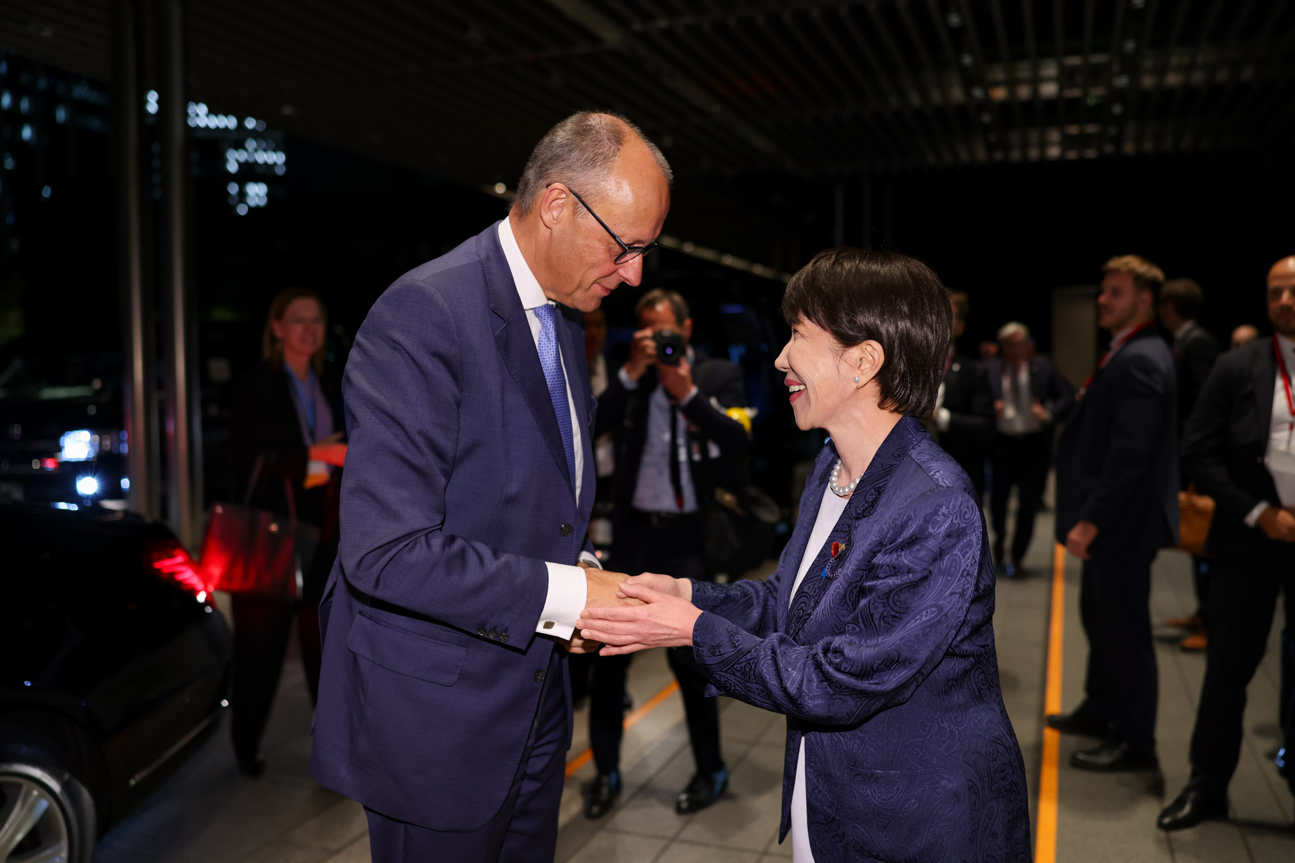 Prime Minister Takaichi welcoming Chancellor Merz