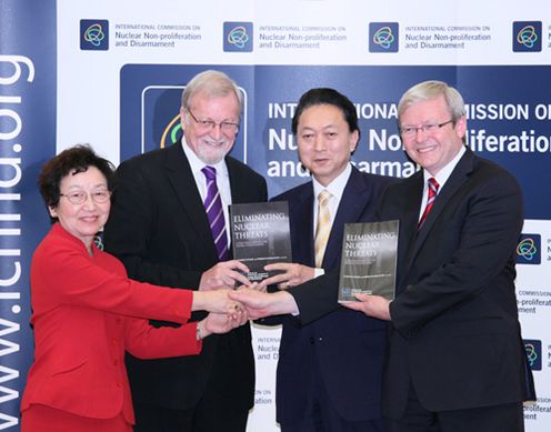 Photograph of the two leaders being presented with member reports of the International Commission on Nuclear Non-Proliferation and Disarmament (ICNND)