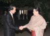 Photograph of Prime Minister Hatoyama shaking hands with President Sonia Gandhi of the Indian National Congress