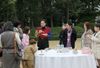 Photograph of the Prime Minister enjoying a barbeque with the participants of the 