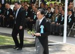 Photograph of the Prime Minister offering a flower 1