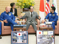 Photograph of the Prime Minister enjoying conversation with the crew of the space shuttle Discovery