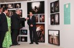 Photograph of the Prime Minister viewing the photo exhibition on AIDS treatment