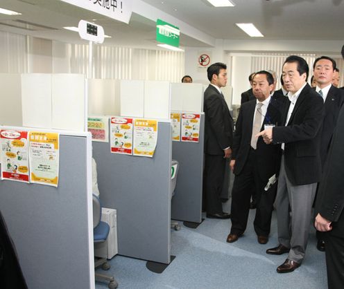 Photograph of the Prime Minister observing special booths to support job placement within the year at a 