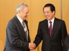 Photograph of Prime Minister Kan shaking hands with Mr. George Soros