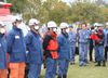 Photograph of the Prime Minister giving words of encouragement to fire fighters at J-Village