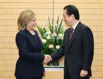 Photograph of Prime Minister Kan shaking hands with Secretary Clinton