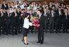 Photograph of the Prime Minister receiving flowers from the staff at the Prime Minister's Office