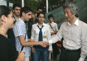 Photograph of Prime Minister shaking hands with the youths from Israel and Palestine