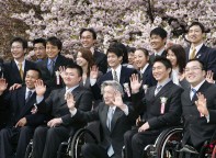 Photograph of Prime Minister chatting with the guests and waving