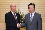 Photograph of the Prime Minister shaking hands with Executive Chairman of the World Economic Forum Dr. Klaus Schwab