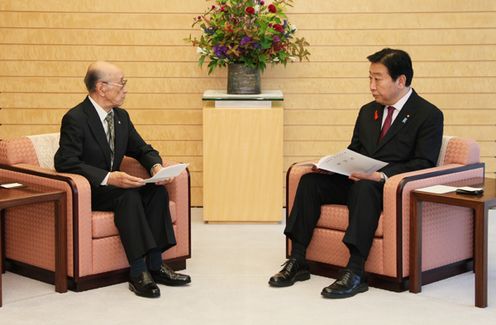 Photograph of the Prime Minister receiving a courtesy call from Director of the League of Residents of Chishima and Habomai Islands, Inc. Toshio Koizumi