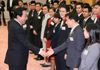 Photograph of the Prime Minister shaking hands with and giving words of encouragement to the representatives of the youths participating in the SSEAYP