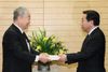 Photograph of the Prime Minister receiving the Interim Report from Chairperson Yotaro Hatamura of the Investigation Committee