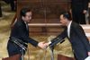 Photograph of the Prime Minister shaking hands with President Tanigaki of the Liberal Democratic Party