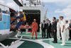 Photograph of the Prime Minister observing the rescue presentation using the on-board helicopter on the patrol vessel <i>Ryukyu</i>