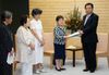 Photograph of the Prime Minister receiving a letter of request from the International Women's Year Liaison Group