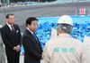 Photograph of the Prime Minister observing the temporary storage site for contaminated soil