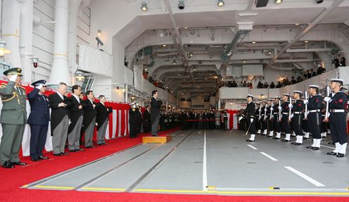 Photograph of the Prime Minister receiving a salute at the 2012 fleet review of the Maritime Self-Defense Force