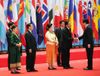 Photograph of the Prime Minister welcomed by and shaking hands with the President of the Lao People's Democratic Republic