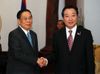 Photograph of Prime Minister Noda shaking hands with the President of the Lao People's Democratic Republic, Secretary General of the Lao People's Revolutionary Party, Mr. Choummaly Sayasone