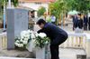 Photograph of the Prime Minister offering flowers at the memorial to the late Police Superintendent Haruyuki Takada 1