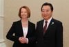 Photograph of Prime Minister Noda shaking hands with the Prime Minister of Australia, Ms. Julia Gillard, at the Japan-Australia Summit Meeting